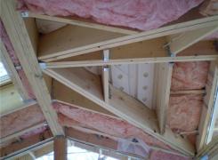 Cathedral ceiling framing with insulation and ventilation baffles