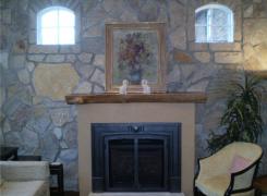 New gas fireplace and stone wall facing