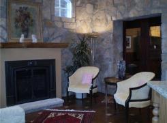 New family room area with stone facing and gas fireplace