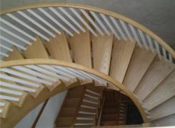 Curved stairs to third floor