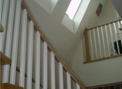 Atrium with skylights & curved stairs