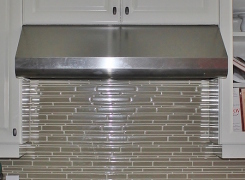 New kitchen glass backsplash gas range and stainless hood