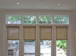 Sunroom glass french doors with transoms facing garden